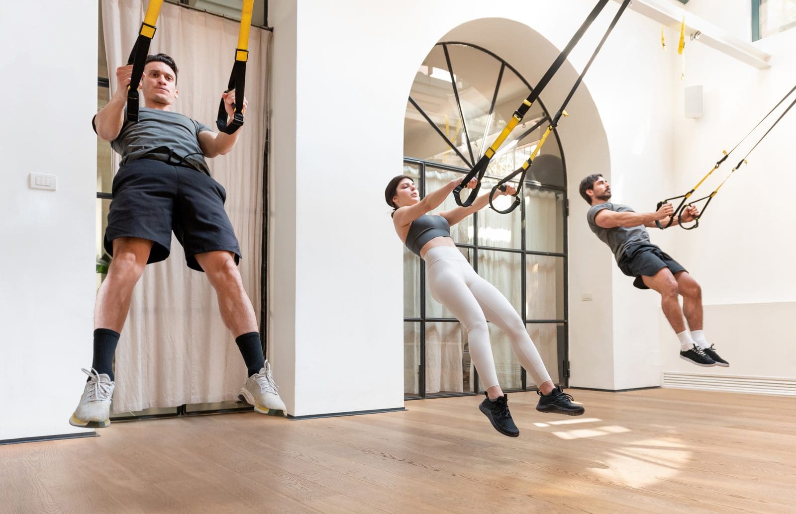 Class performing trx squat jumps 1176868 1